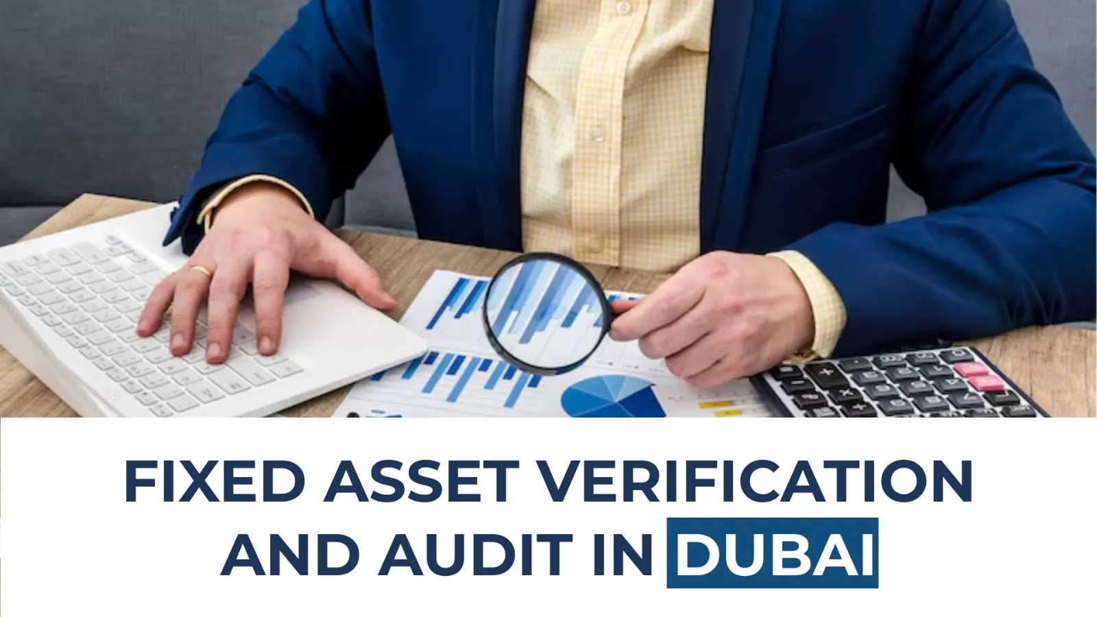 Professional reviewing financial charts with magnifying glass during fixed asset verification in Dubai